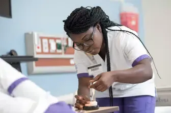 Nursing student in a lab